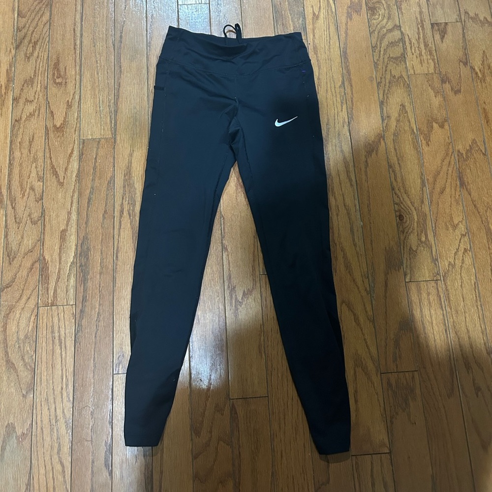 Nike leggings with drawstrings and mesh lining on the lower back legs size XS